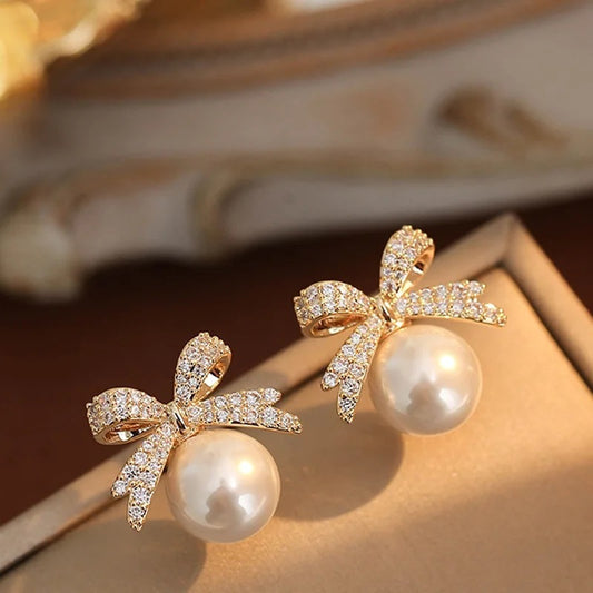 Gold Shiny Bow-Tie Pearl Earrings